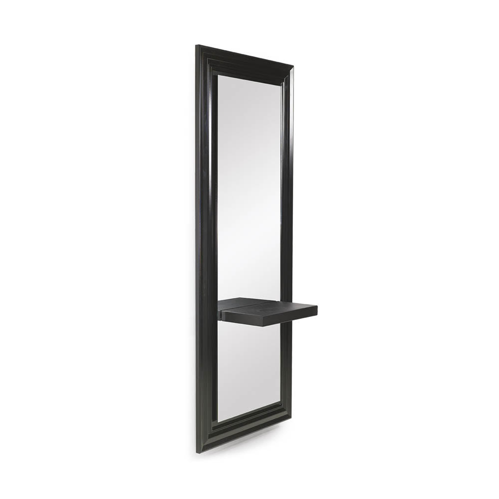 Tall black framed mirror with attached shelf on white background.
